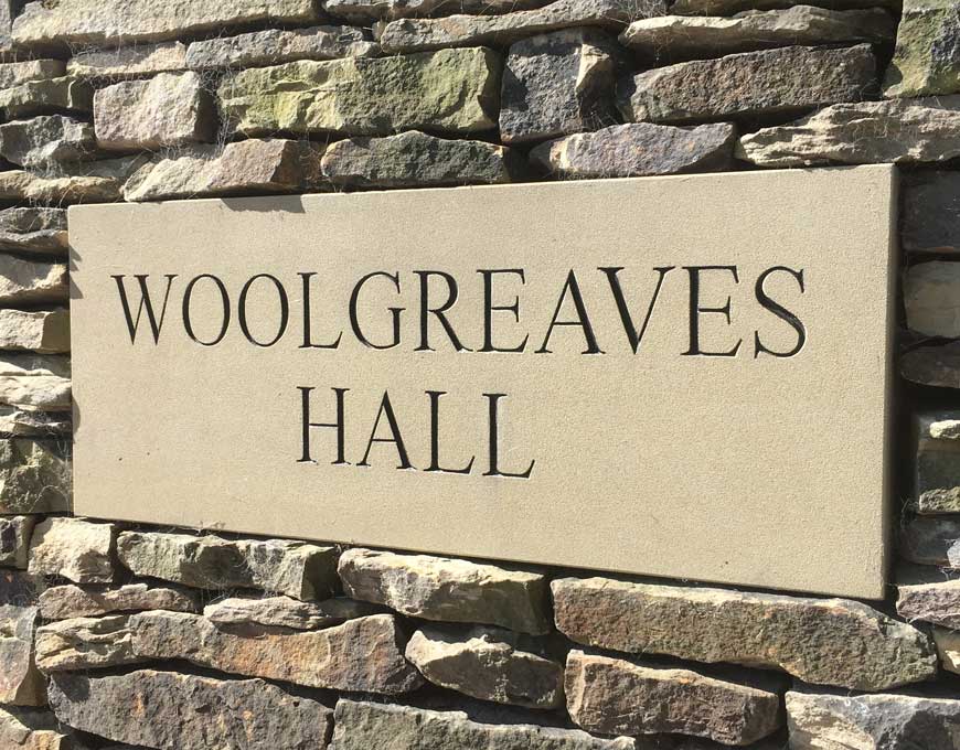 stone house sign lettering crafted by stone mason