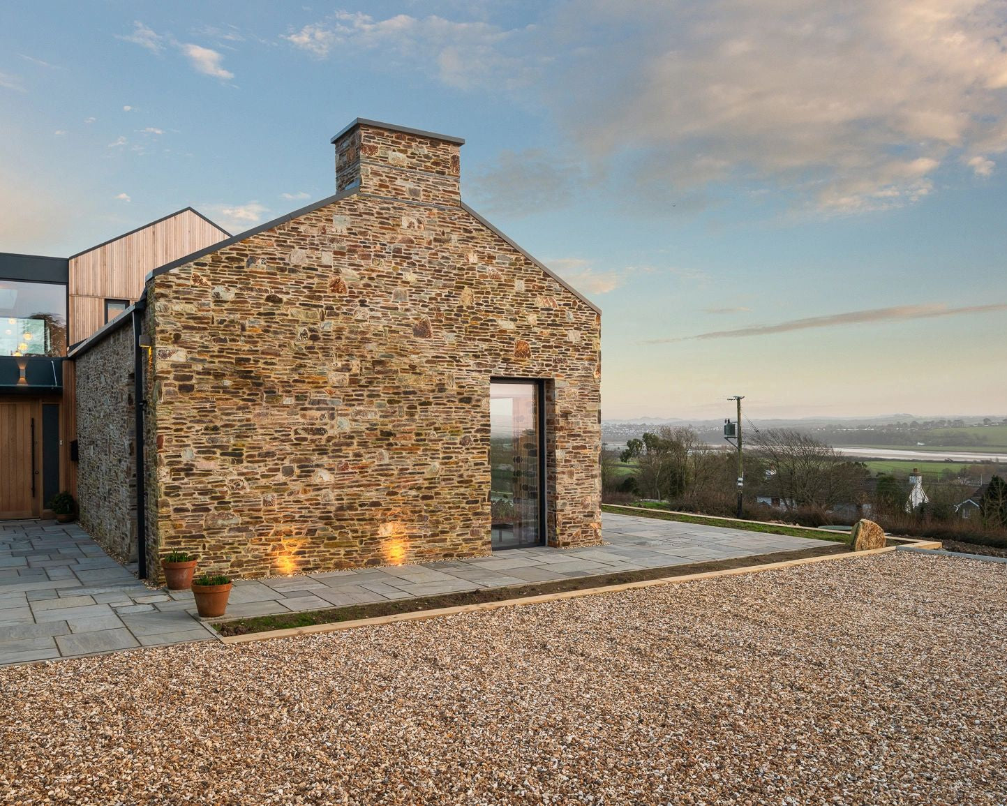 Reclaimed Stone Built Barn designed by famous architect in London featuring reclaimed Yorkshire stone paving flag stones