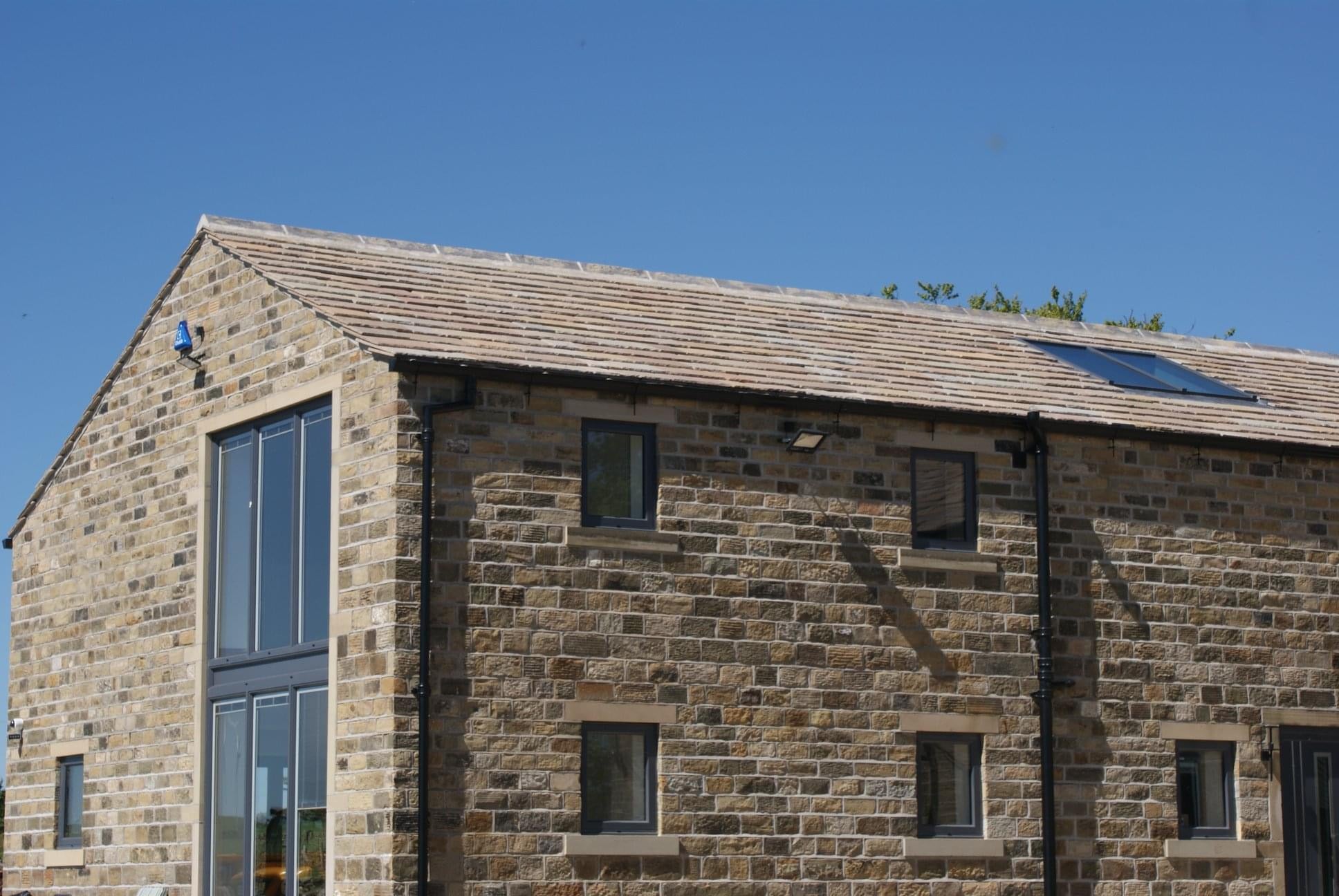 Traditional Stone House built using Yorkshire stone roofing slates and parallel punch facing stone
