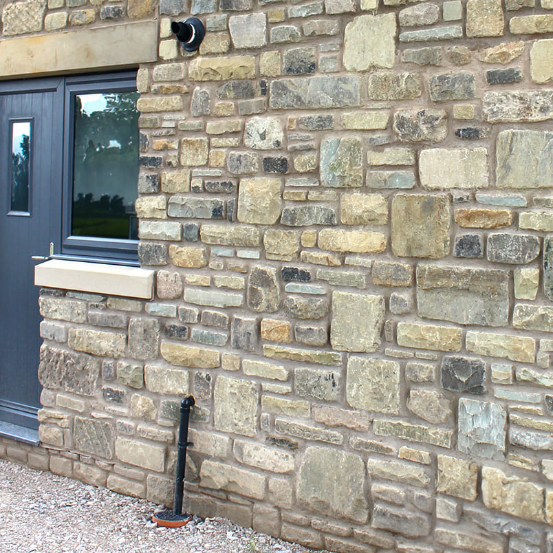 Stone Matching - Traditional random tumbled stone supplied by Britannia Stone - New build extension with matched tumbled stone