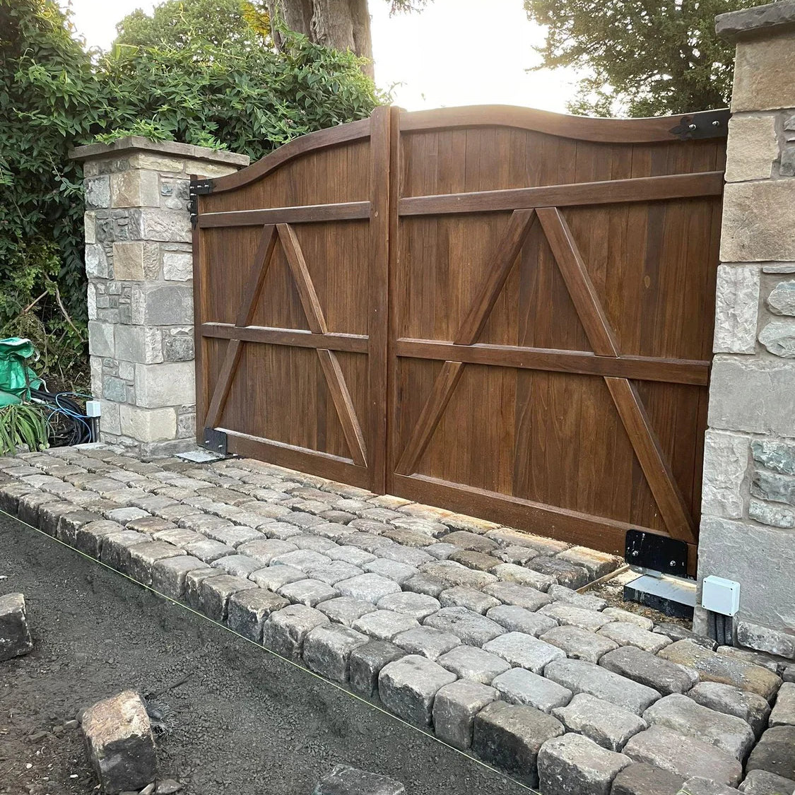 Reclaimed stone cobbles used to create a bell mouth styled entrance to greet friends & family visiting our home