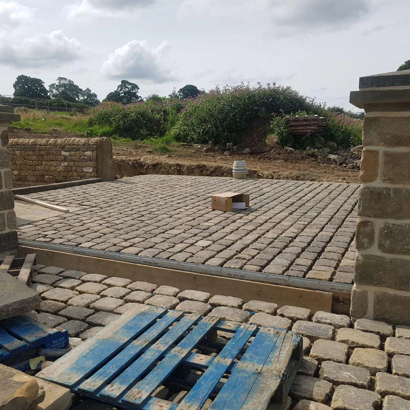 Reclaimed Grit Stone Cobbles by Britannia Stone, example of Grit Stone cobbled court yard