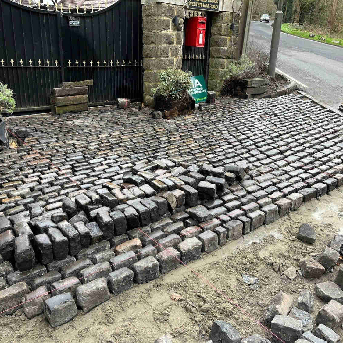 Reclaimed  cobble setts driveway under construction |  Britannia Stone