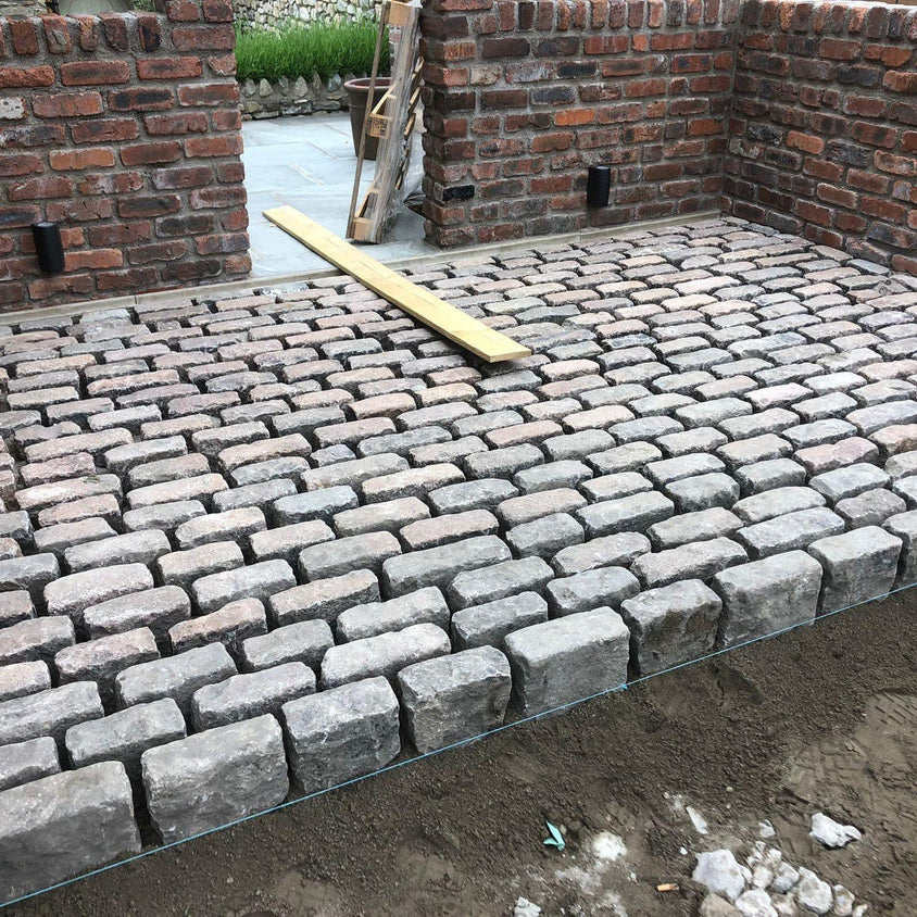 Granite Setts - Reclaimed granite stone cobble setts by Britannia Stone, example of cobbled courtyard