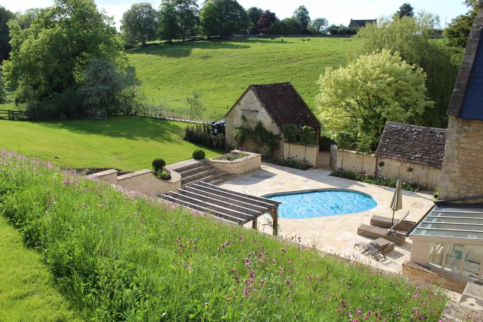 Large garden swimming pool, stone design supplied by Britannia Stone 