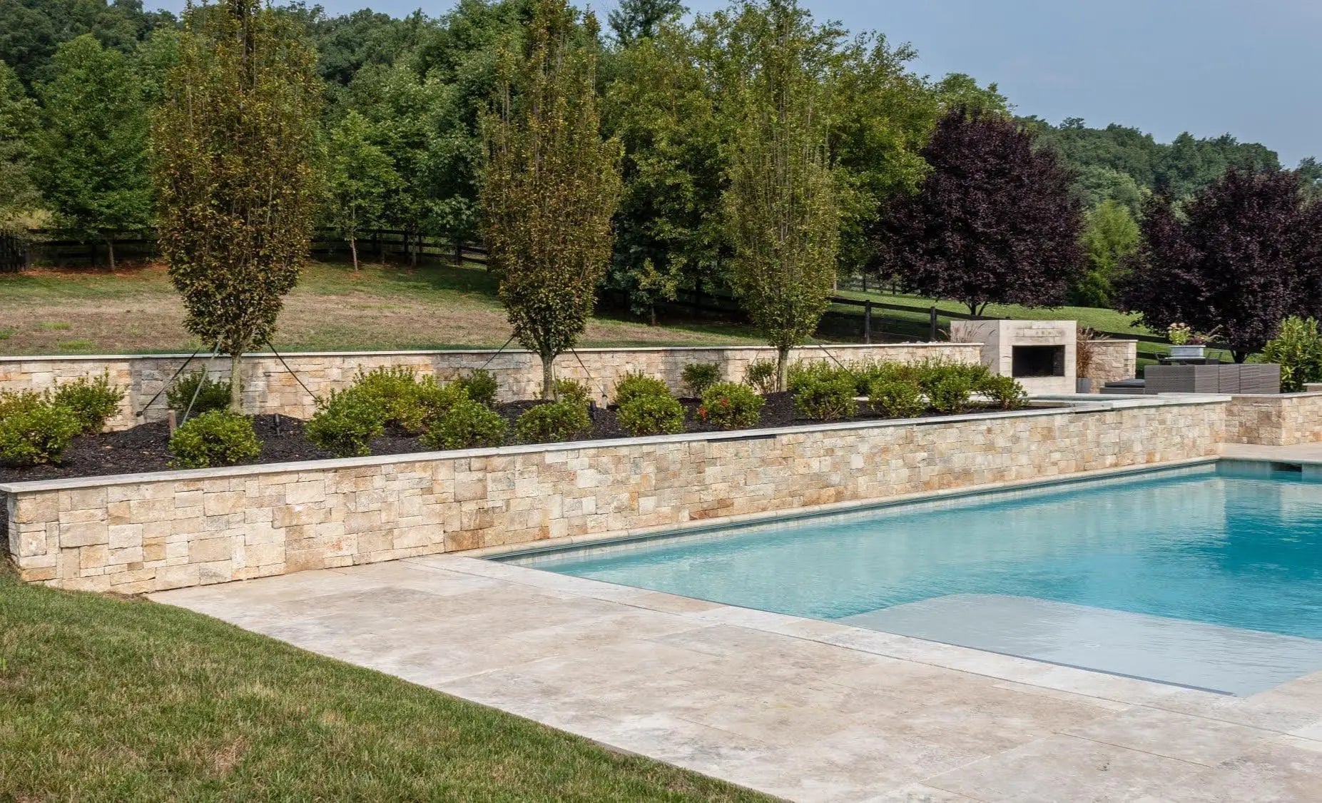 Natural British Stone Swimming Pool  and stone paving and stne wall