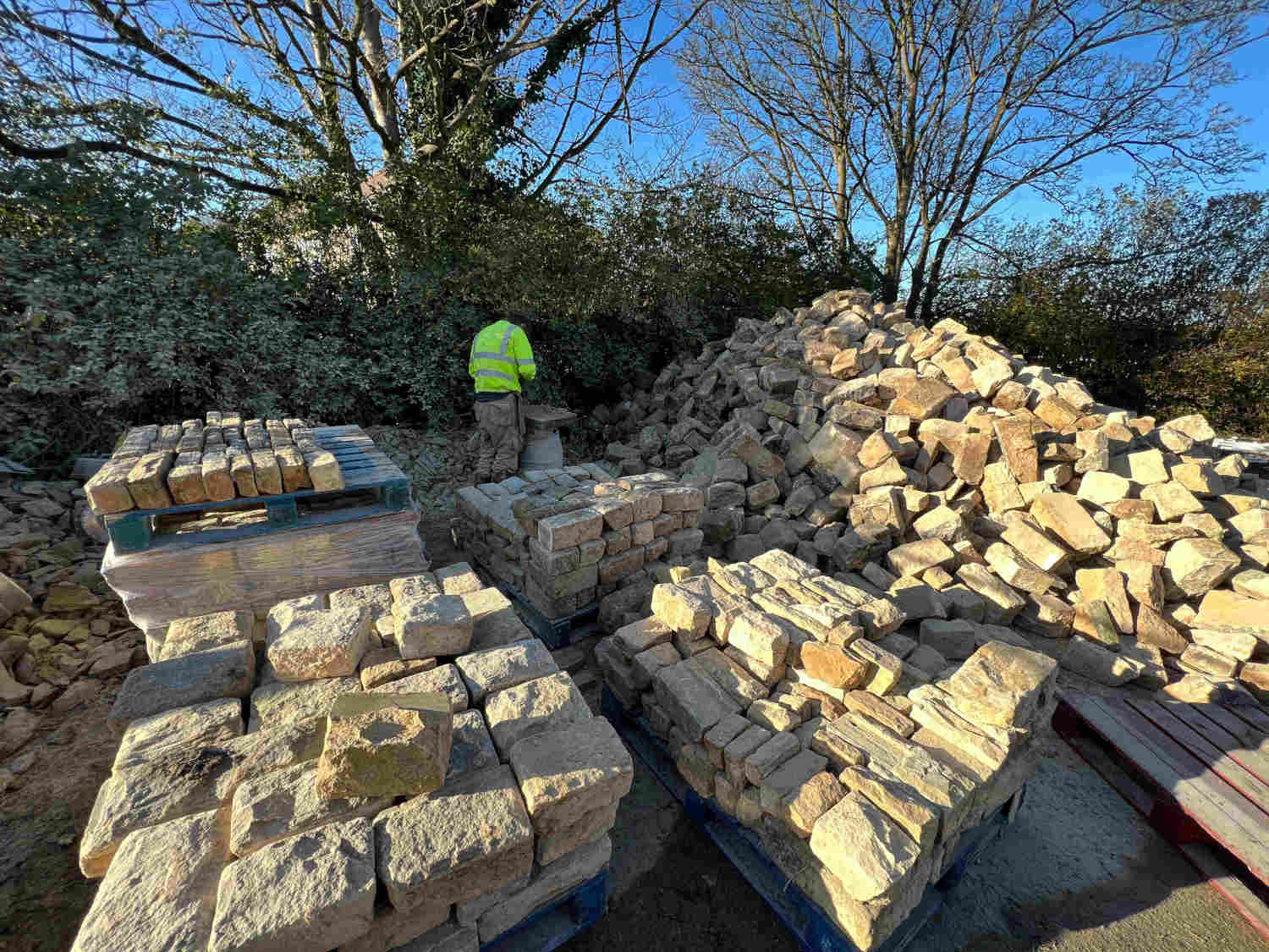 Stone mason dressing reclaimed delph stone from old pub demolition in Sheffield | Britannia Stone