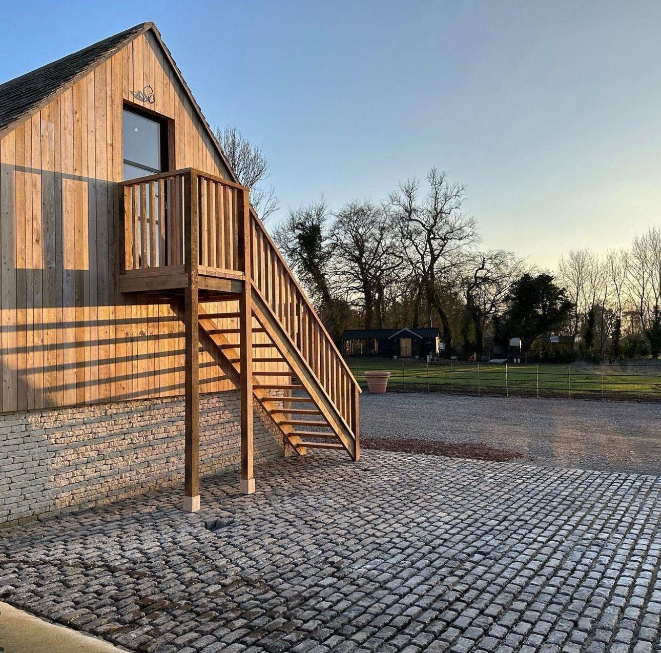 Granite Setts - Reclaimed mixed granite stone cobble setts by Britannia Stone, example of cobbled court yard