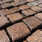 Reclaimed pink 4-x-4 cube granite-cobble setts Britannia Stone